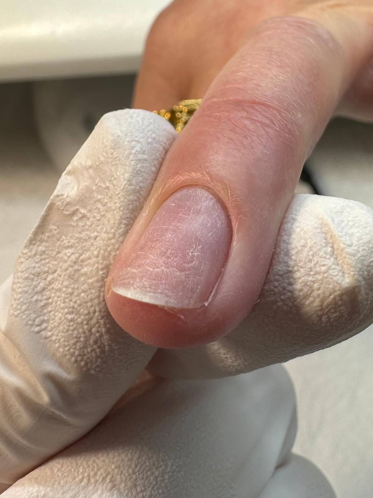 Russian manicure nail preparation, skin polishing, cuticle removal